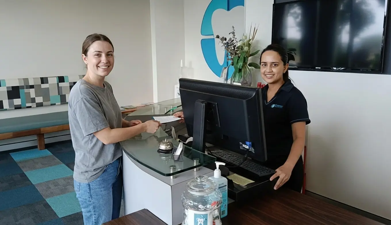 Happy patient smiling at Compass Dental